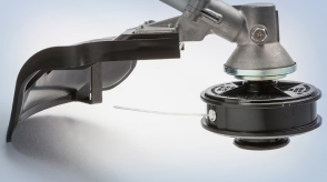 A close-up image of a Honda handheld tool is pictured in a neutral environment. 