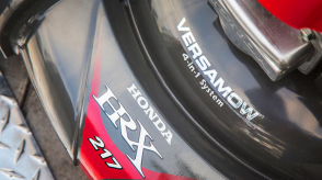 Closeup of the front of a Honda lawn mower. 