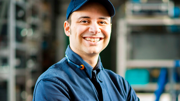 A technician smiling.